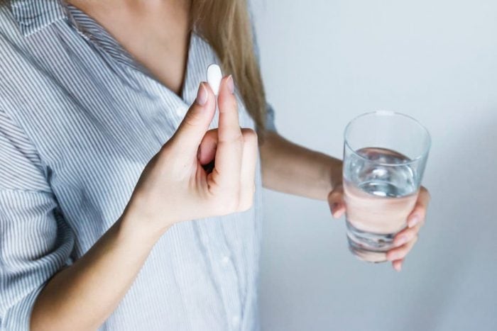 Woman Taking Supplements